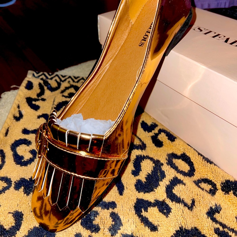 Never been worn , bronze shoes